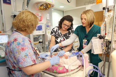 Researchers have developed and patented a rapid blood test that shows which patients are at low, medium, and high risk for death from sepsis. Above, staff care for a baby in the pediatric intensive care unit at Cincinnati Children's Hospital Medical Center. Image courtesy of Cincinnati Children's Hospital.